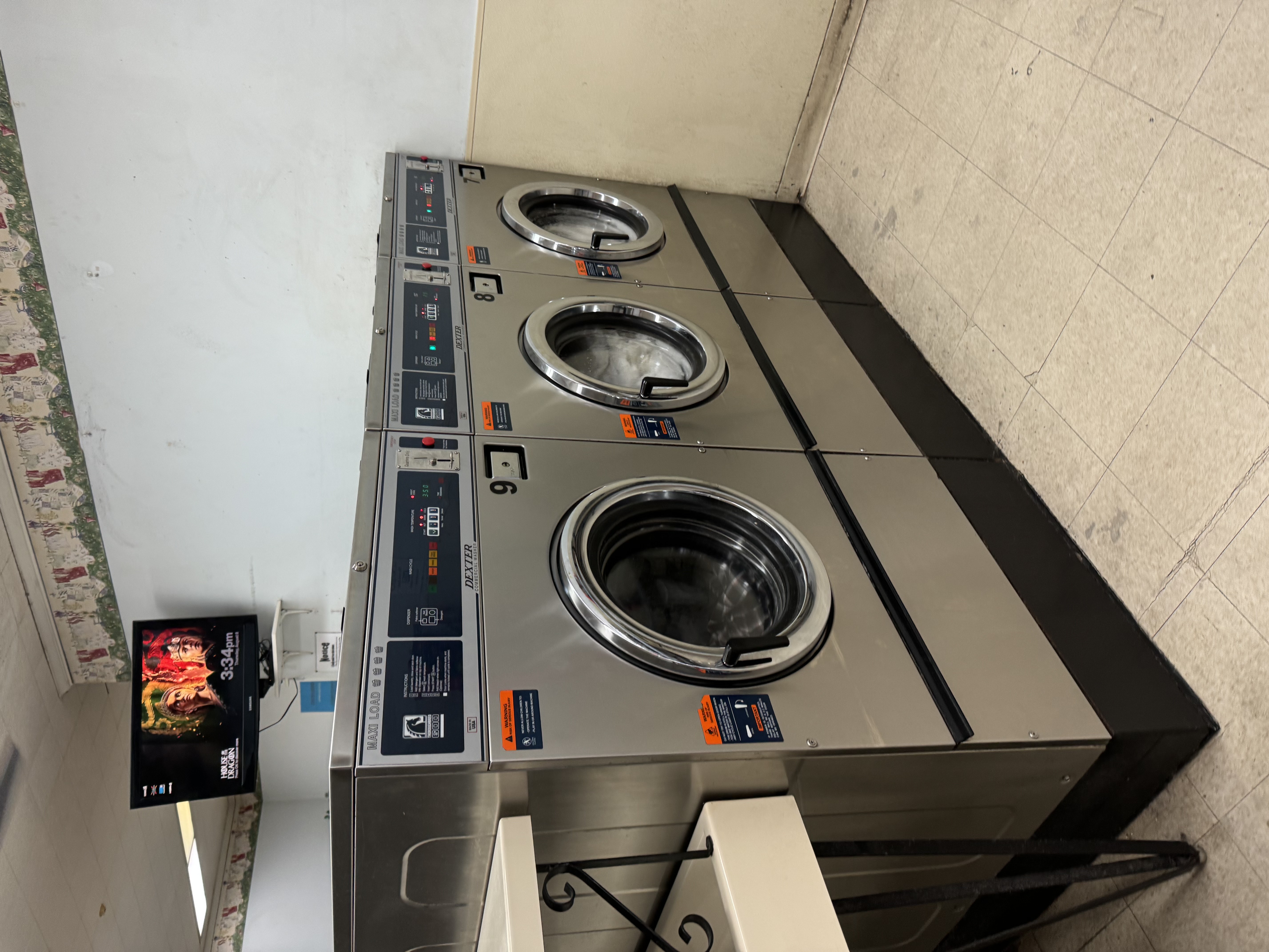 Interior view showing rows of modern washing machines